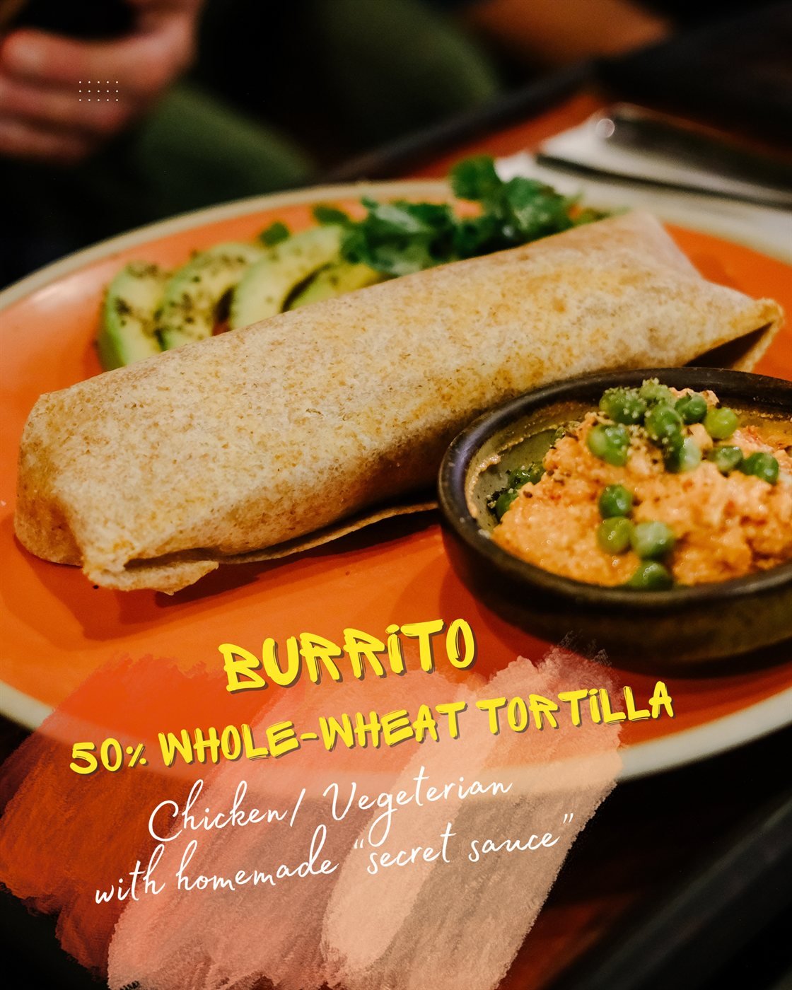 Socialhouse burrito with 50% whole-wheat tortilla, chicken or vegetarian, with homemade secret sauce