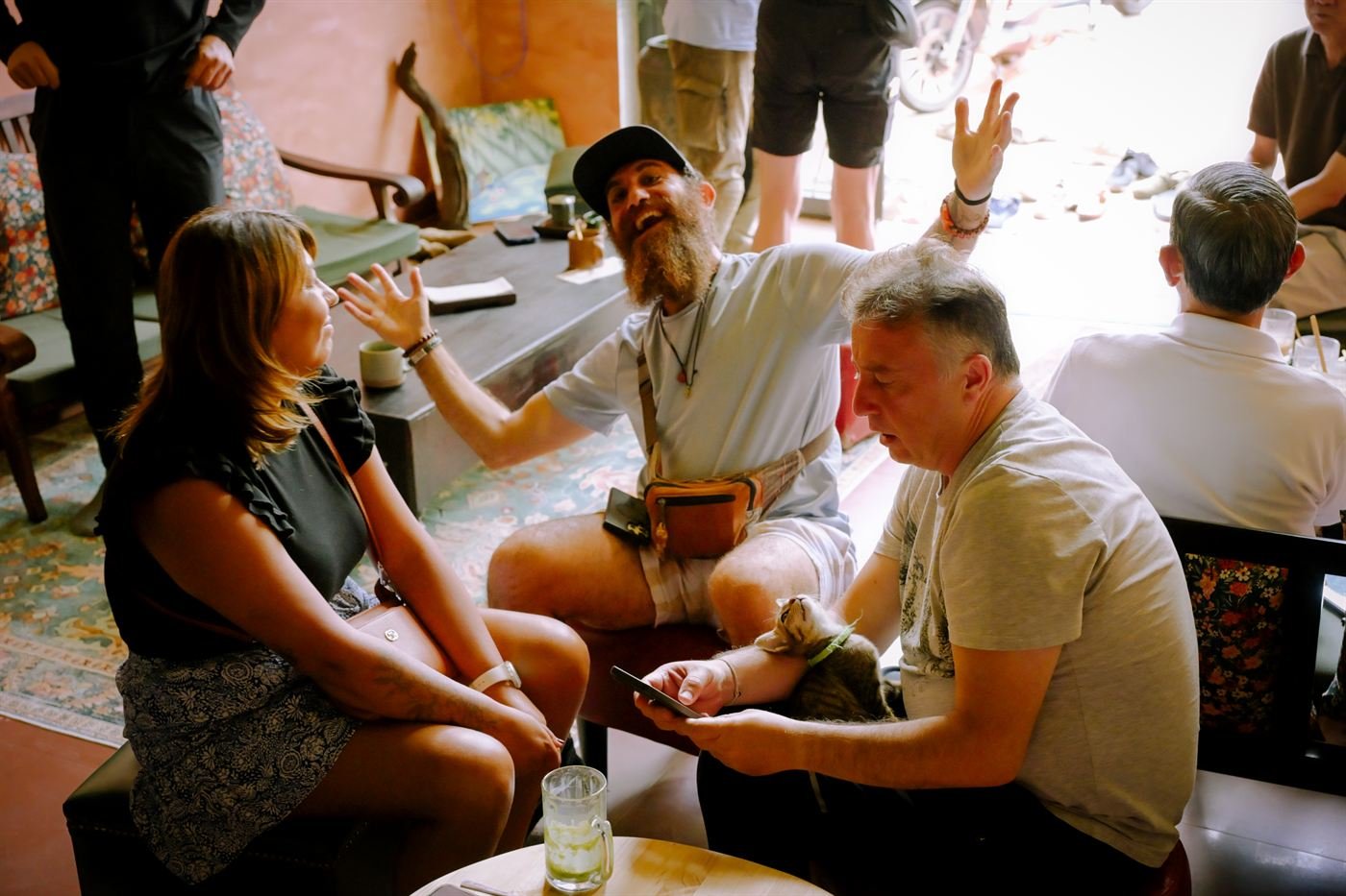 Guests laughing and chatting at the event