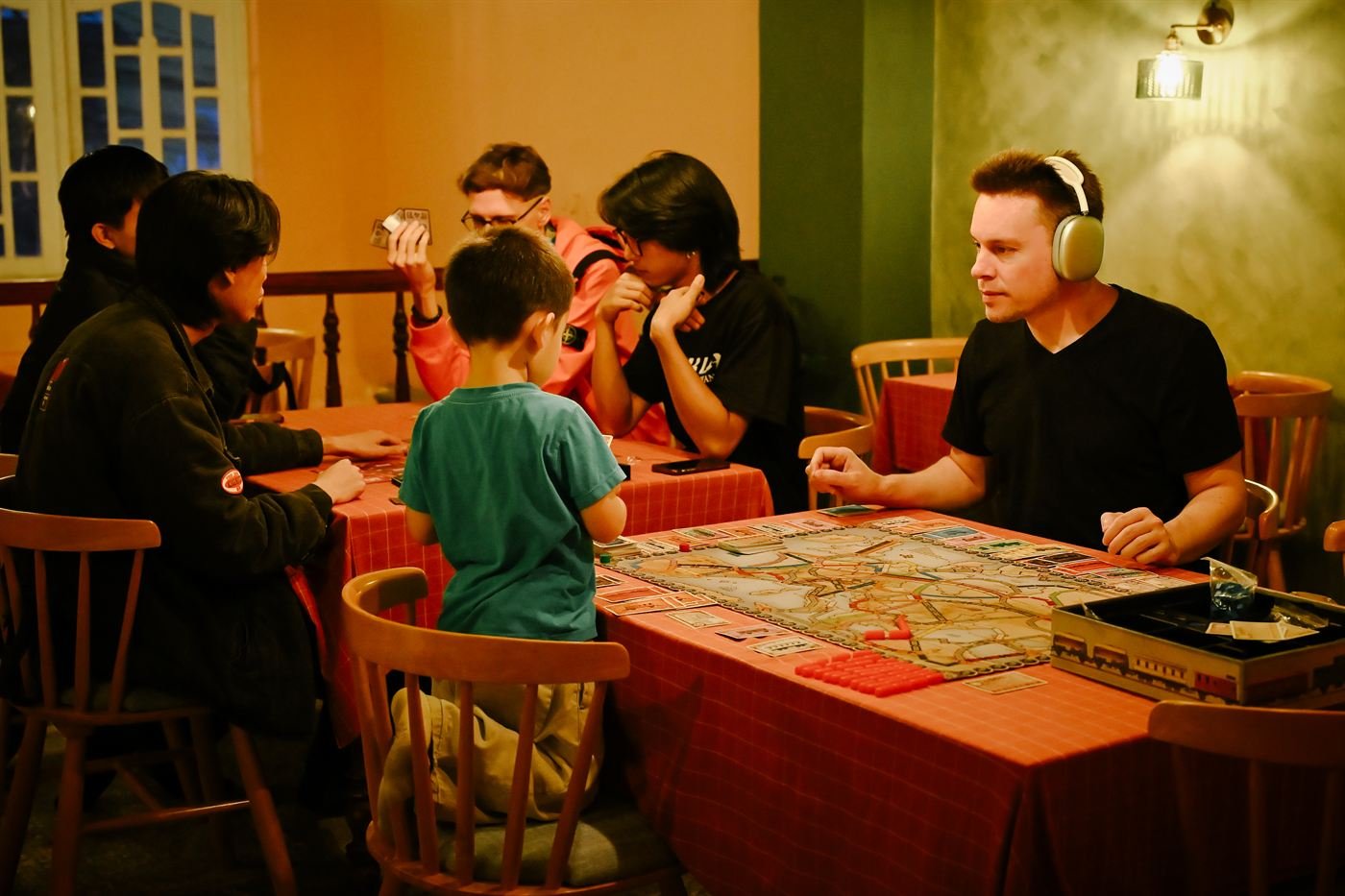 Guests of all ages playing a board game