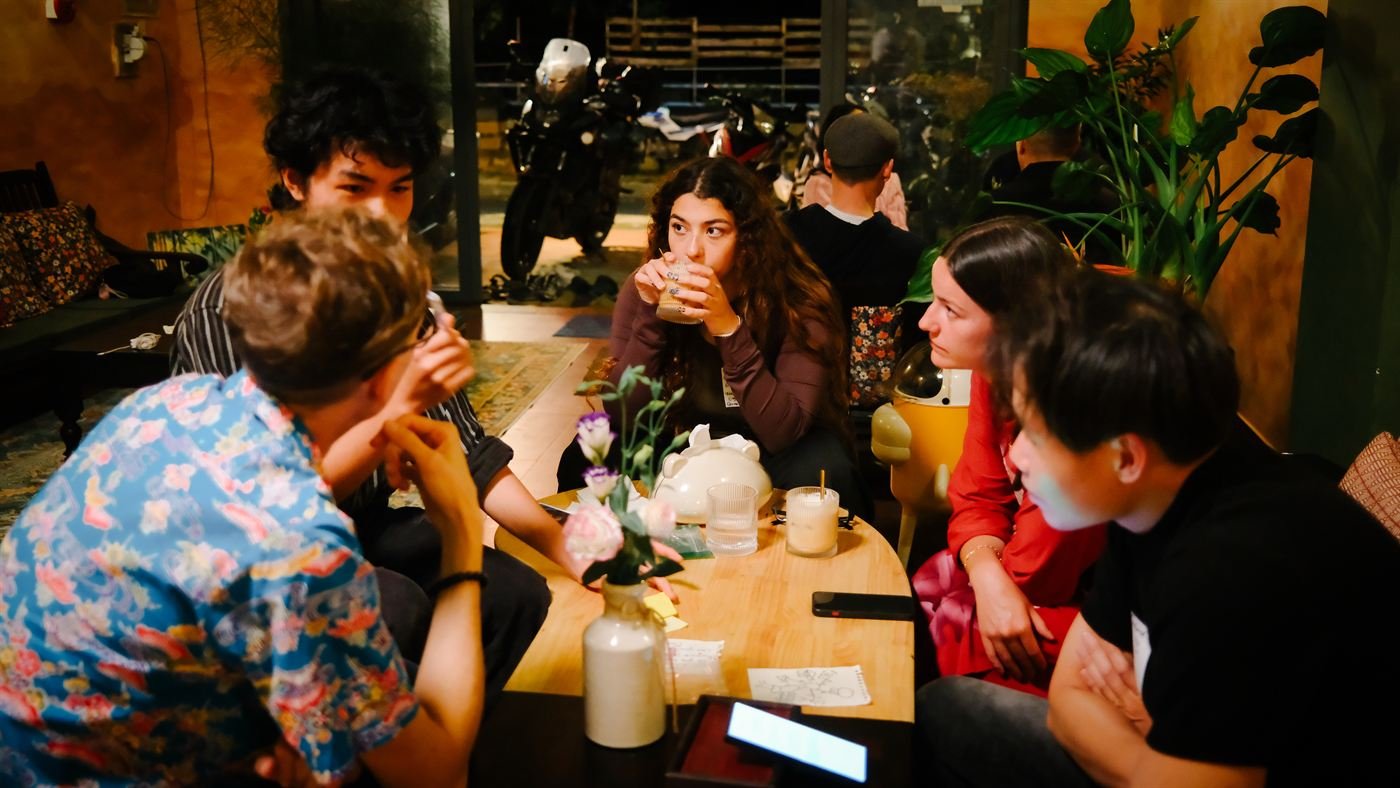 Guests chatting in different languages around a table