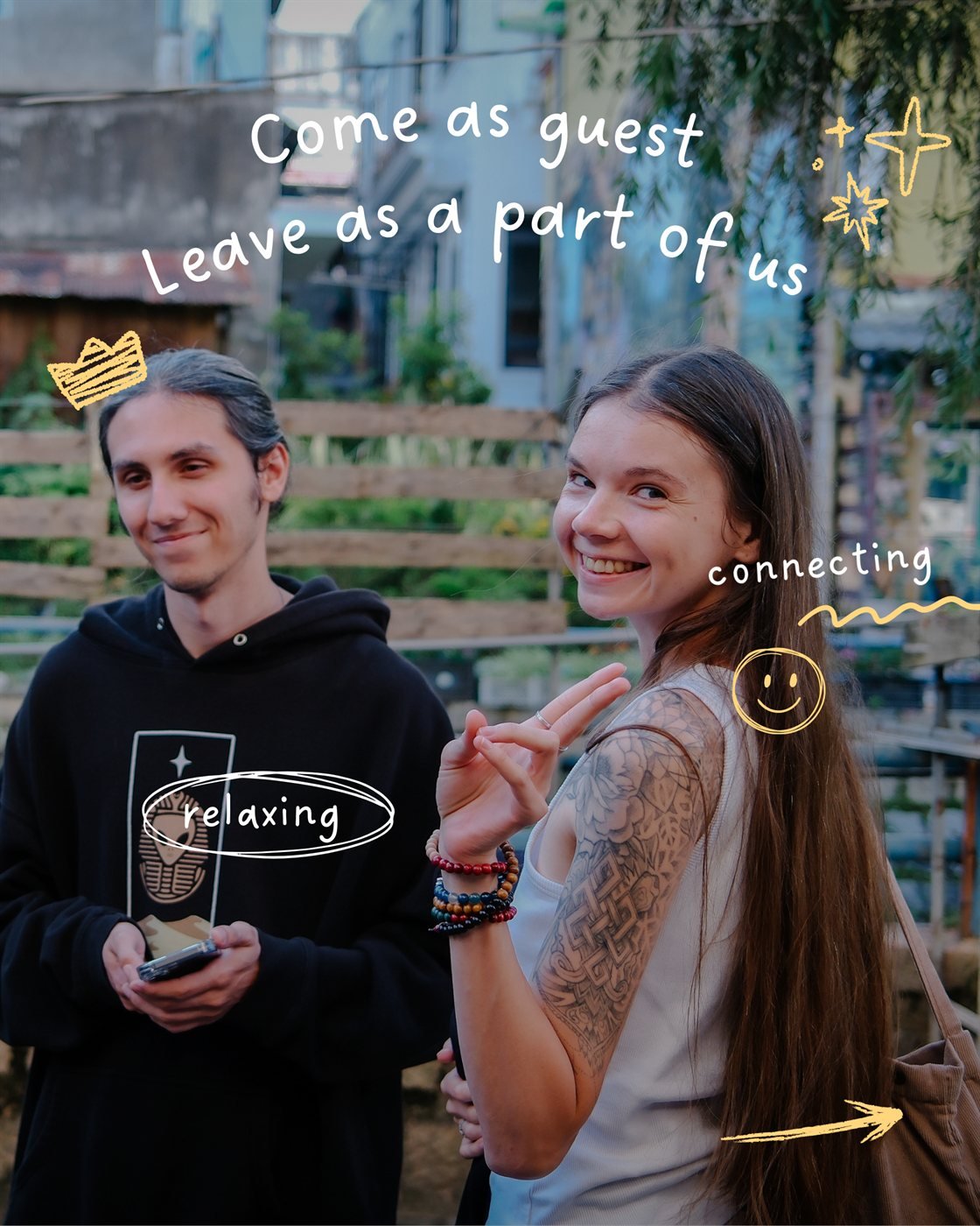 Come as guest, leave as a part of us – two friends smiling outside Socialhouse Dalat